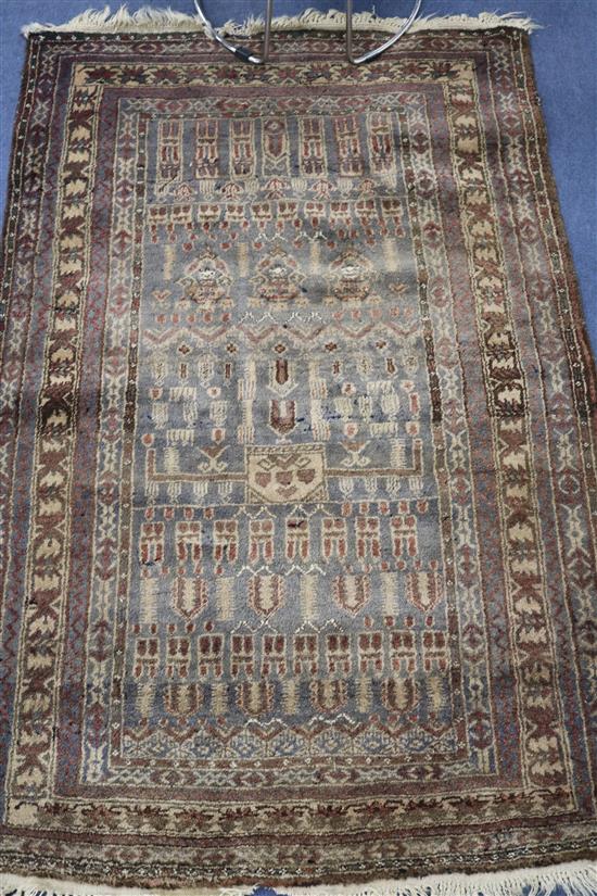 A Persian beige ground rug, 4ft 11in. x 3ft 3in.